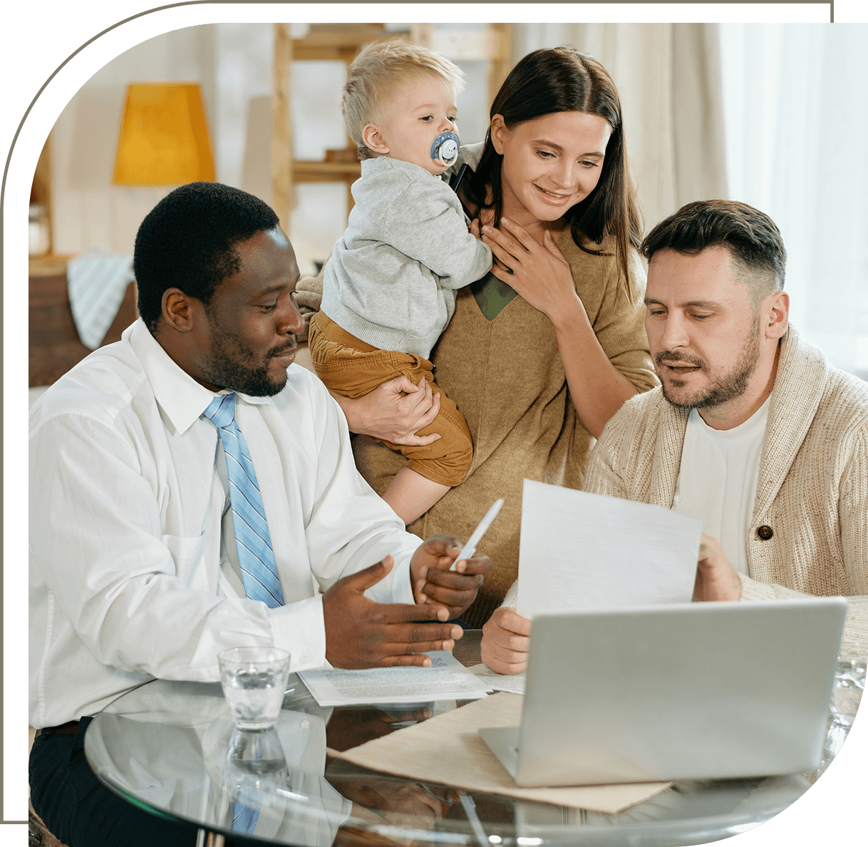 Family consulting with professional at table.